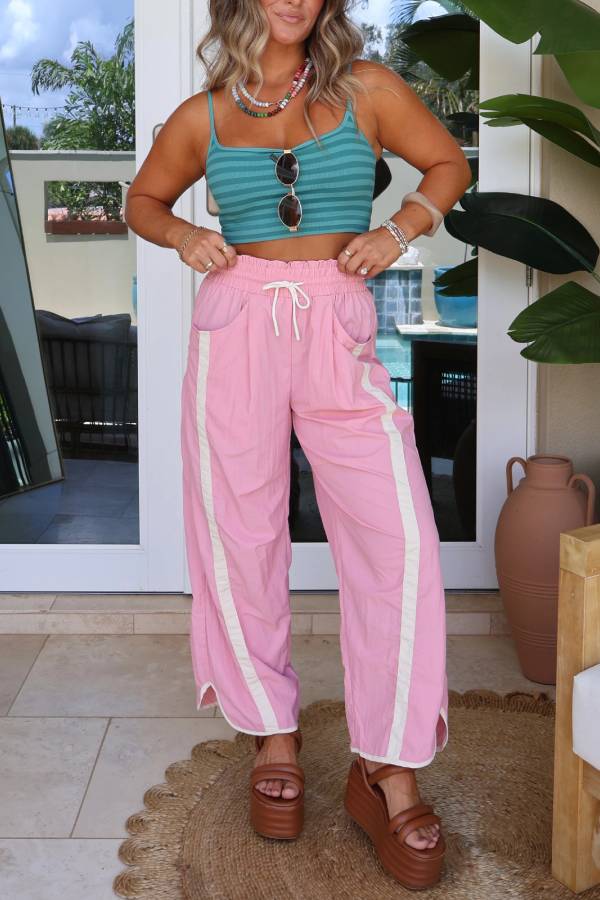 Pantalón paracaídas en crudo y rosa