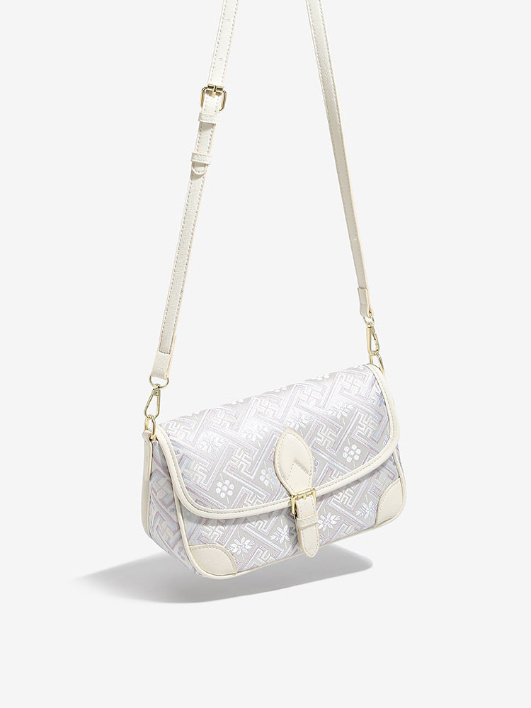 Bolso clutch de piel vegana con jacquard bordado