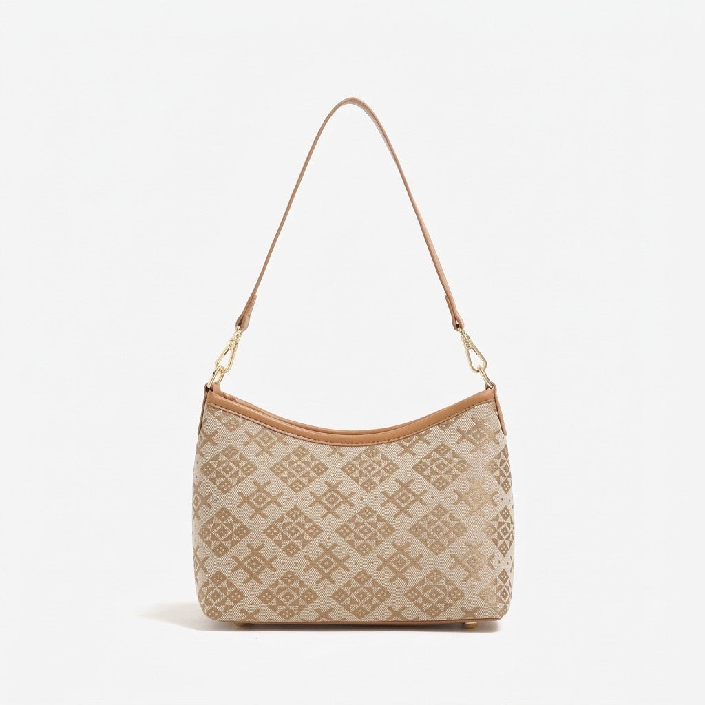 Bolso clutch vintage de piel vegana con monograma