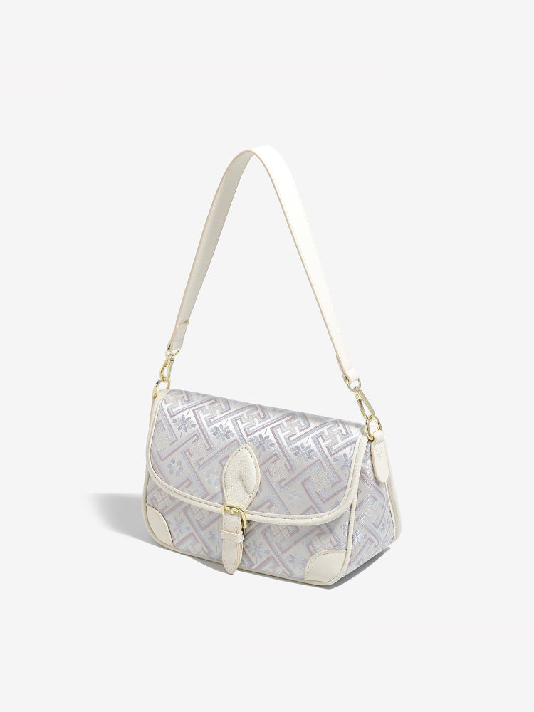 Bolso clutch de piel vegana con jacquard bordado