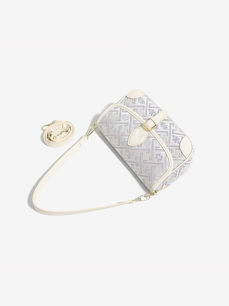 Bolso clutch de piel vegana con jacquard bordado