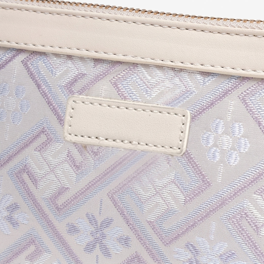 Bolso mini clutch de piel vegana con jacquard pastel