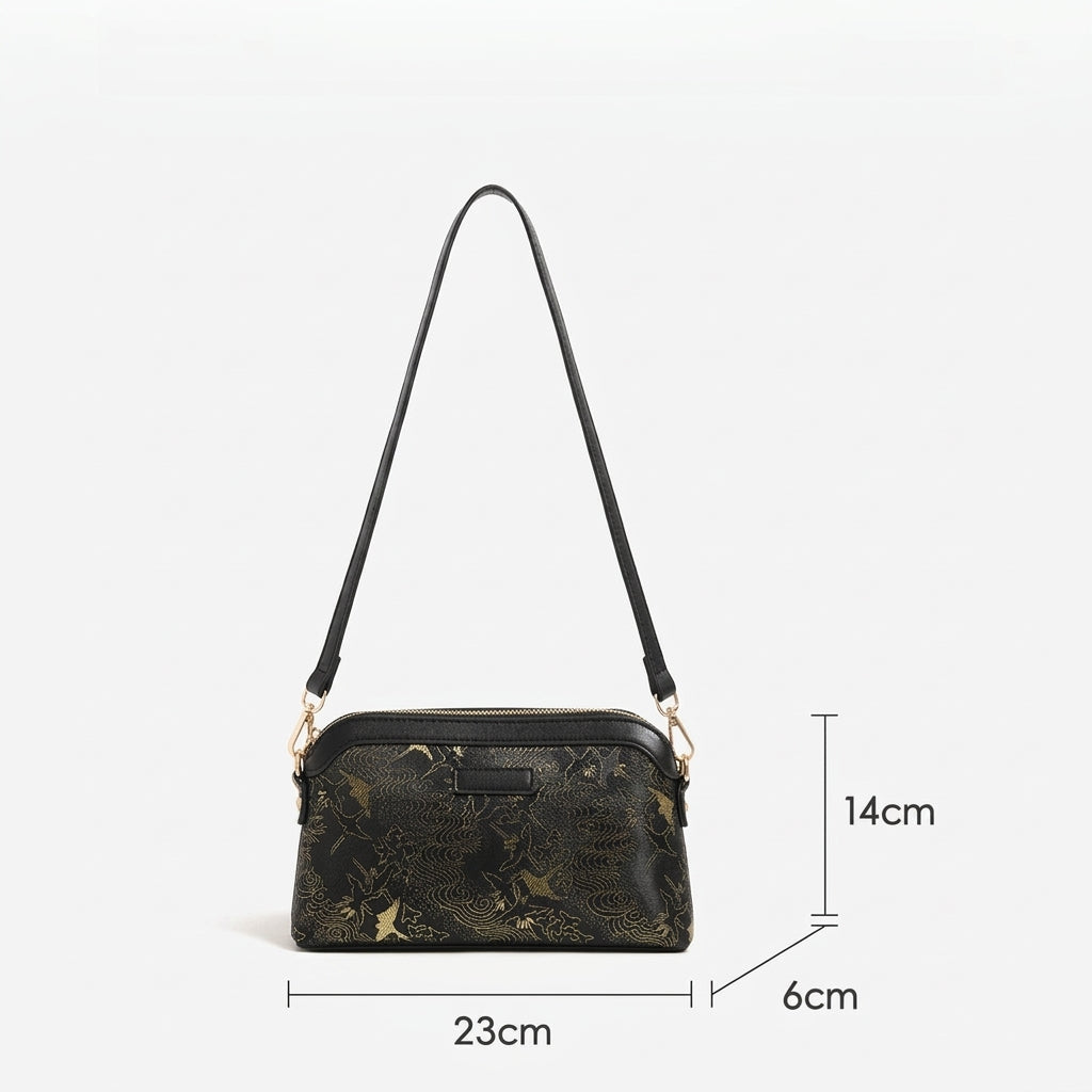 Bolso clutch de piel vegana con estampado de grullas