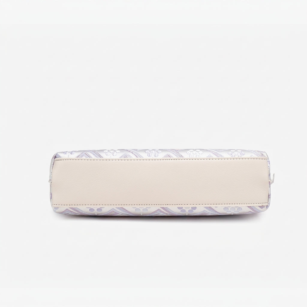 Bolso mini clutch de piel vegana con jacquard pastel