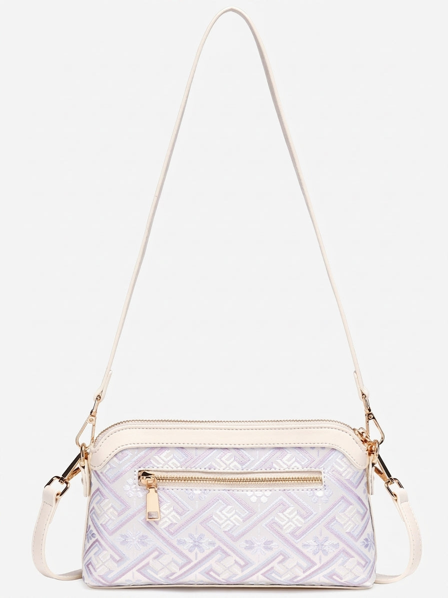 Bolso mini clutch de piel vegana con jacquard pastel