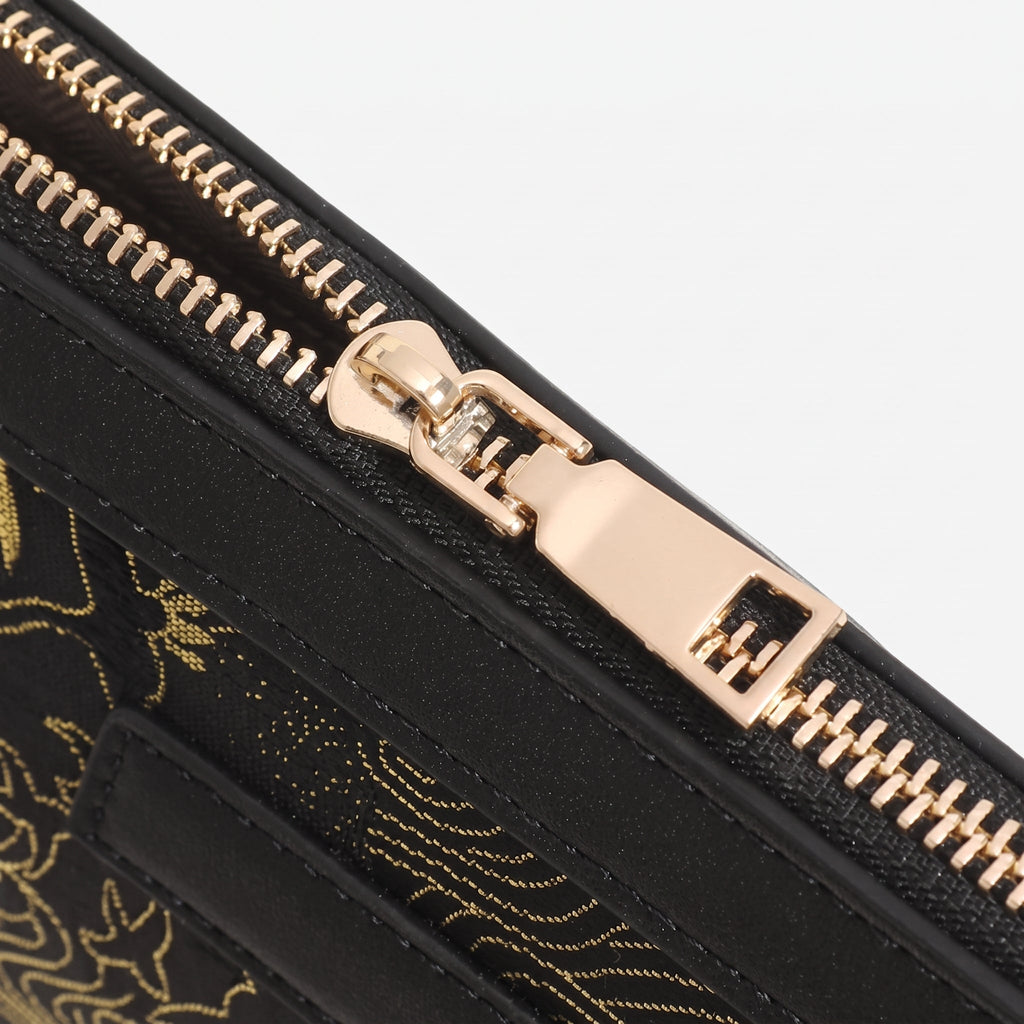 Bolso clutch de piel vegana con estampado de grullas