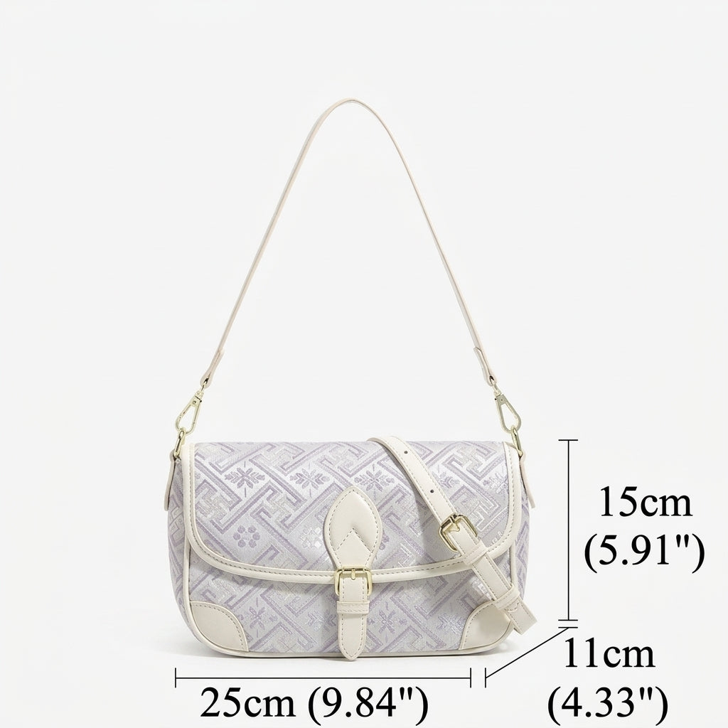 Bolso clutch de piel vegana con jacquard bordado