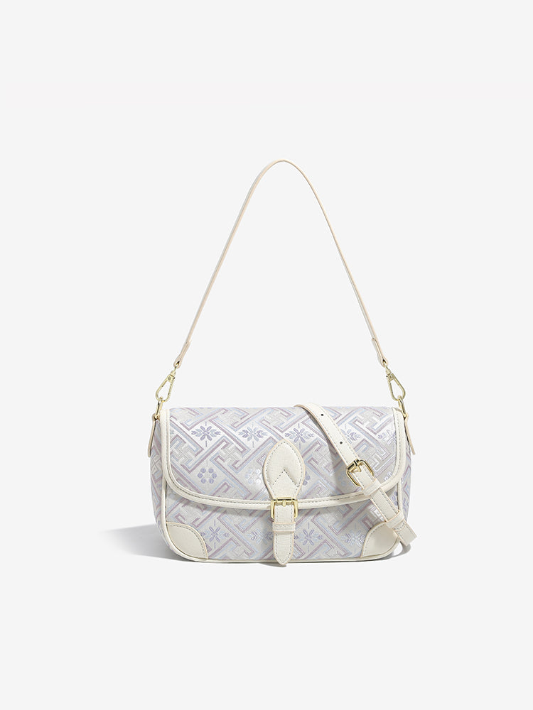 Bolso clutch de piel vegana con jacquard bordado
