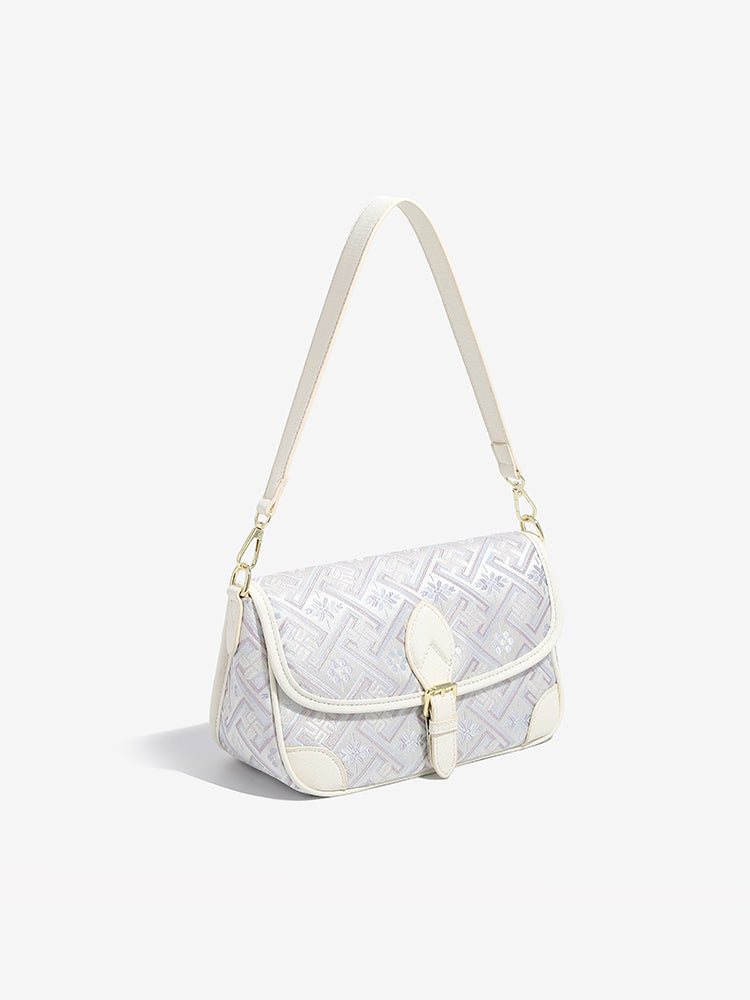 Bolso clutch de piel vegana con jacquard bordado