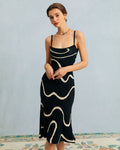 Vestido midi de punto negro con bajo sirena